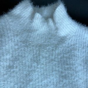 Fluffy looking white-beige sweater